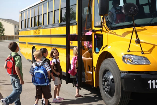 Students getting on school bus
